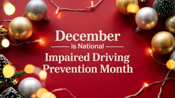 Holiday-themed graphic with "December is National Impaired Driving Prevention Month" text on a red surface scattered with ornaments and blurred background lights.